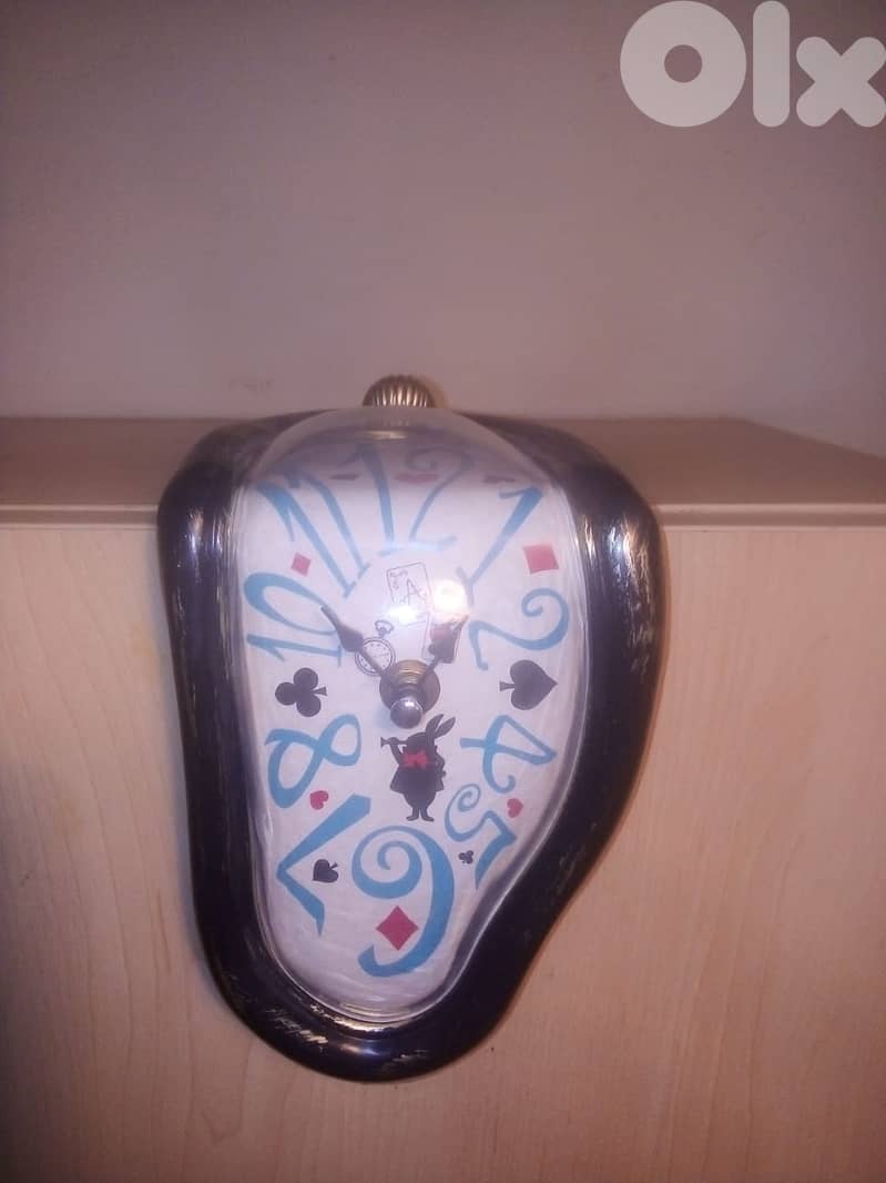 Melting clock inspired by the art of Salvador Dali. decorative clock 0