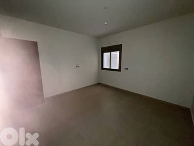 RWK163JS - Apartment For Sale In Ballouneh - شقة للبيع في بلونة