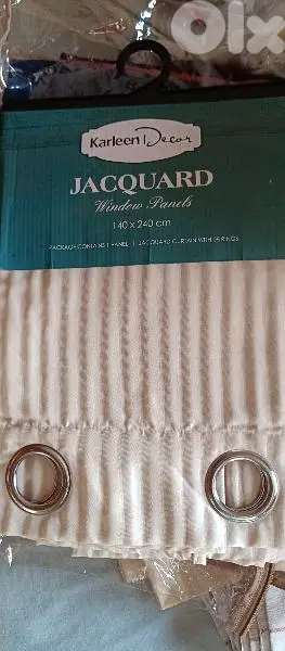 two curtains light beige color. 140x240 cm with 8 silver rings each
