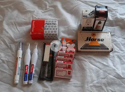Staples, Tipex, paper clip, and stamp pad & ink