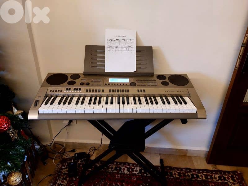 Piano casio english and arabic +stand 2