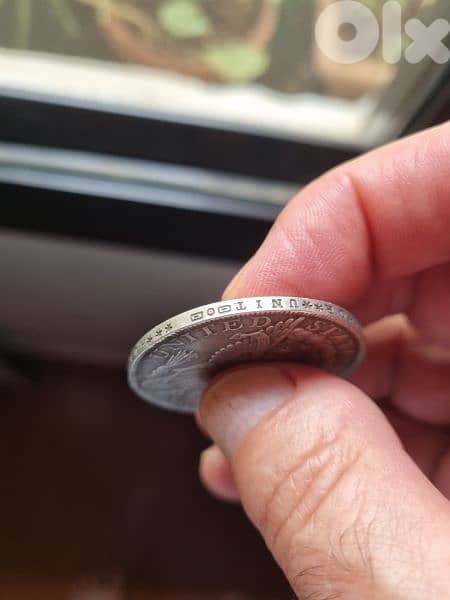 A silver old coin 15 dollars the gram 1