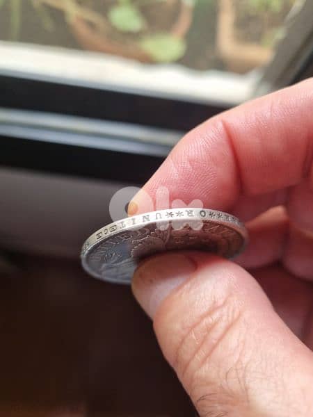 A silver old coin 15 dollars the gram 2