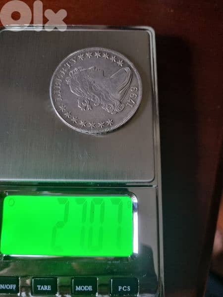A silver old coin 15 dollars the gram 7
