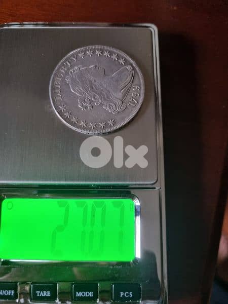 A silver old coin 15 dollars the gram 8
