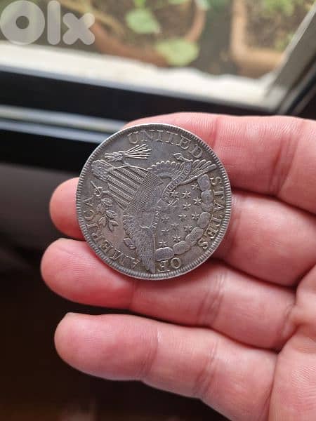 A silver old coin 15 dollars the gram 10