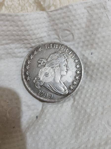 A silver old coin 15 dollars the gram 12