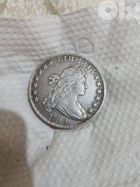 A silver old coin 15 dollars the gram 13
