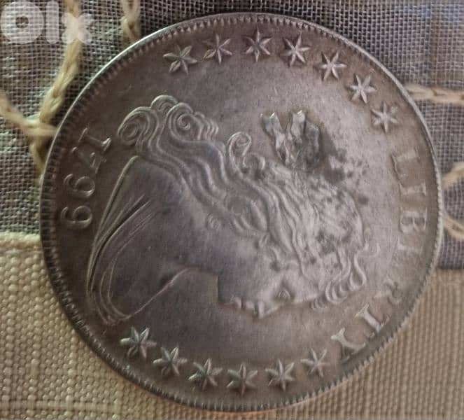 A silver old coin 15 dollars the gram 16
