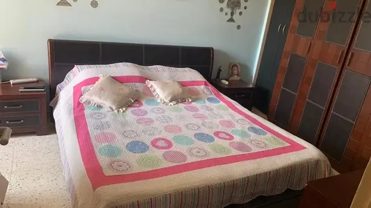 Leather and Zein Wood brown KING sized Bed