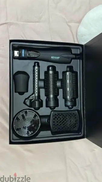 ReVAMP hot brush for styling, perfect condition barely ever used. ReVAMP hot brush for styling, perfect condition barely ever used.