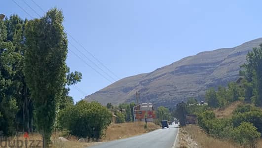 Land on Tilal El Aassal highway for sale