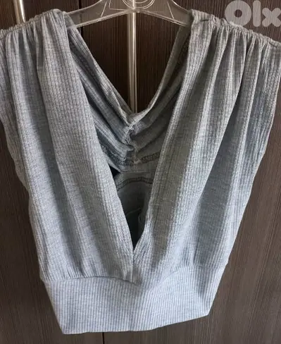 A Medium Size Gray Crop Top