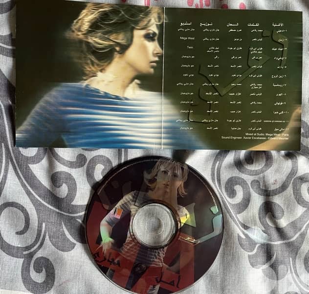 two cds original with no cover : zein el omor& amal hijazi both 5 $ 1