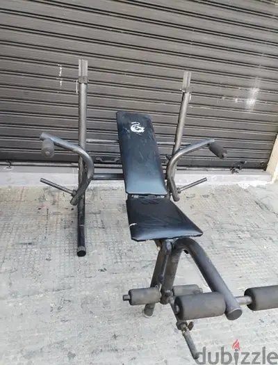 Adjustable bench with Rack used like new 68$