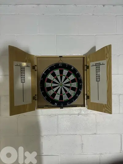 dart board with wood house