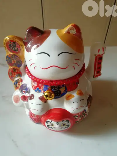 Traditional Japanese porcelain cat with waving hand works on 2 AAA ba
