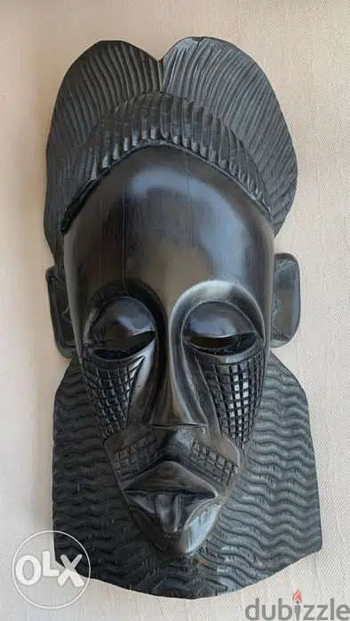 Ebony wood . handmade African mask