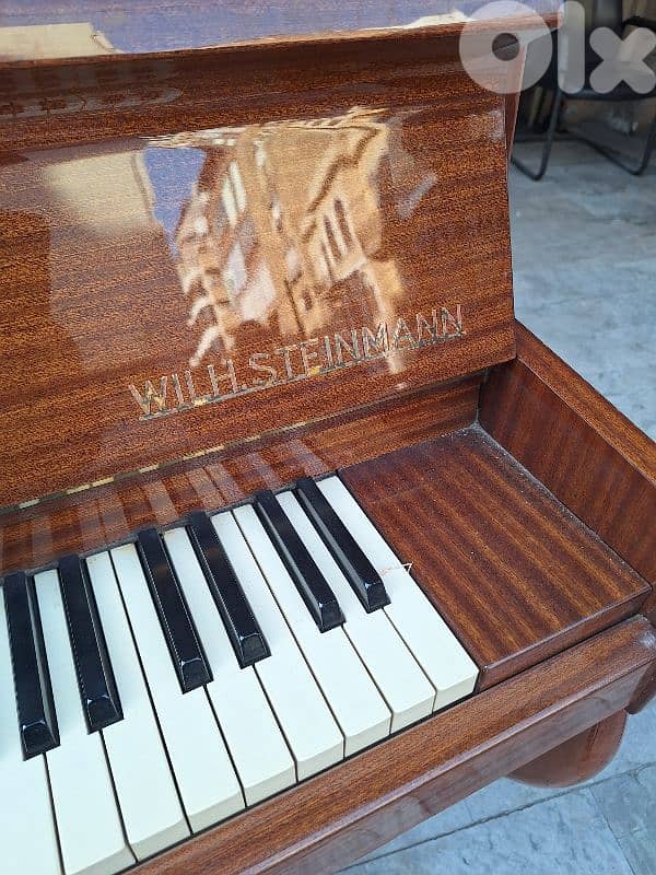 piano with. Steinmann Germany like new tuning warranty 2
