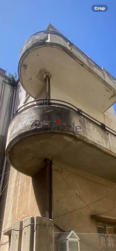 Building with land in achrafieh prime location