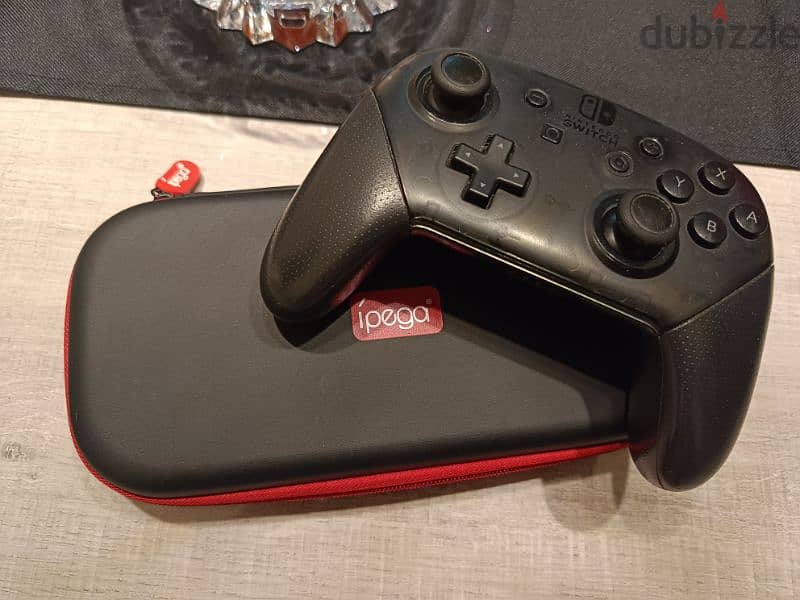 Nintendo Switch Lite + Switch Pro Controller 1