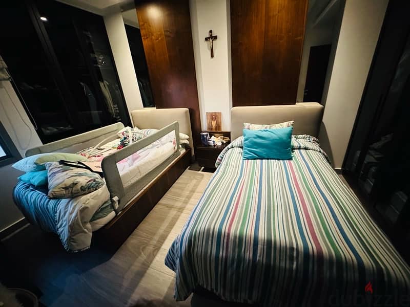 two single beds with mattresses 0