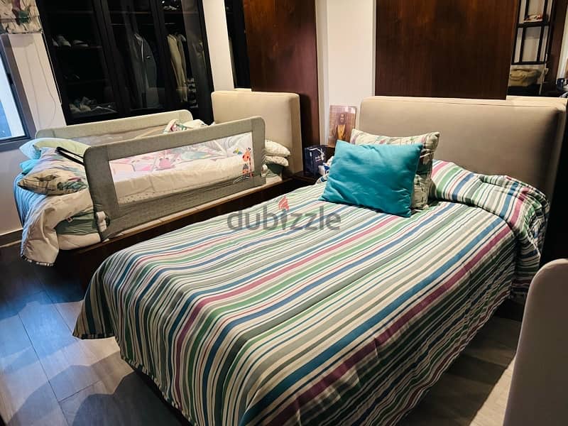 two single beds with mattresses 1