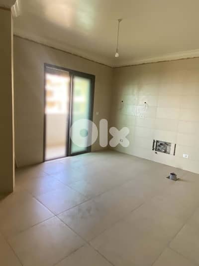 spacious apartment in Mazraat Yachouh /مزرعة يشوع REF#OY122578