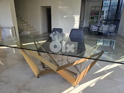 Glass dining table without chairs