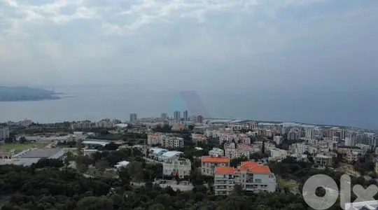 1003 m2 land+sea/mountain view 4sale in Adma - أرض للبيع في أدما