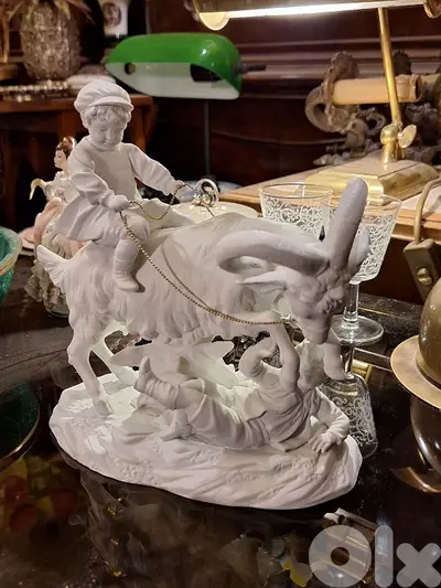antique biscuit statue