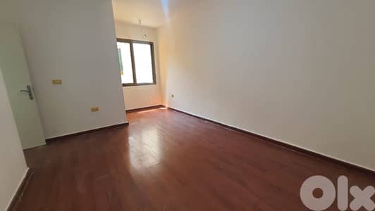 SPACIOUS APT LOCATED IN AIN EL REMANEH , BADARO SIDE (BDA-164)