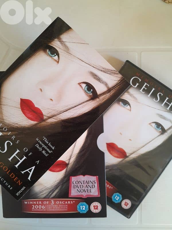 "Memoirs of a Geisha" by Arthur Golden, includes both the book and DVD 0