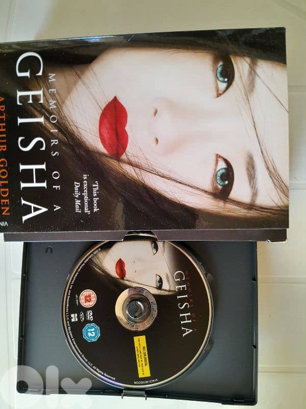 "Memoirs of a Geisha" by Arthur Golden, includes both the book and DVD 1