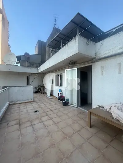 Rooftop apartment with terrace for rent in Achrafieh, prime location.