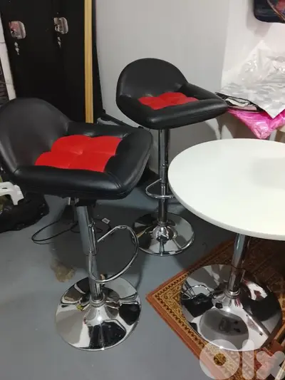 two chairs with a table