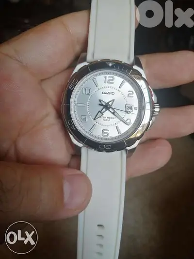 Casio analog white stainless steel.