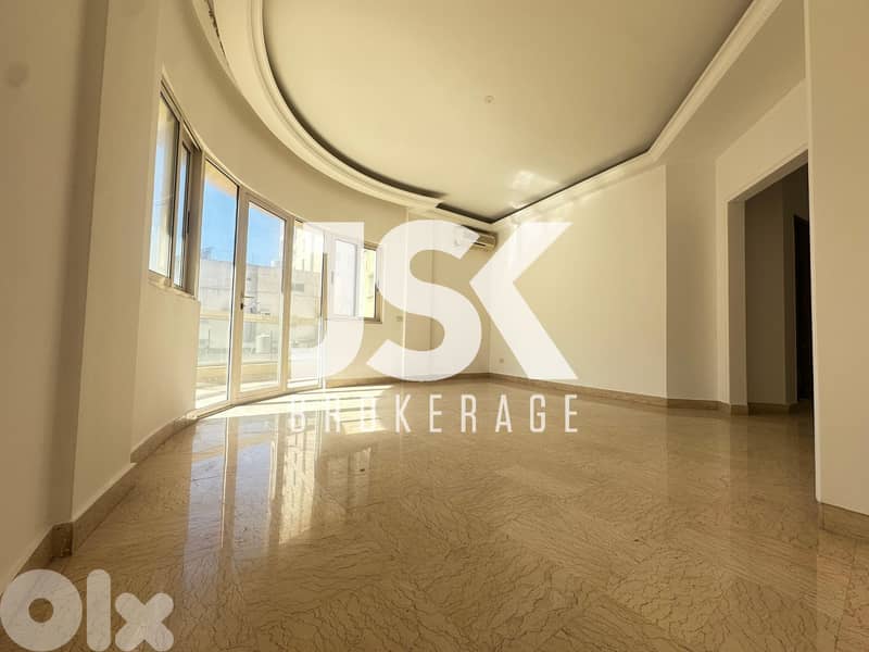 L19613 - Bright Apartment with Open View For Rent in Ain El Mreisseh 0