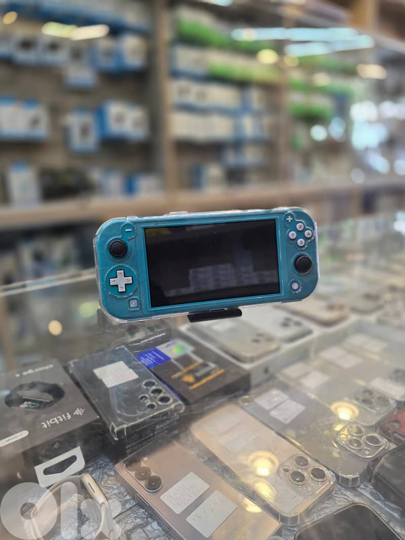 Used  nintedno switch lite  turquoise 100$ 0