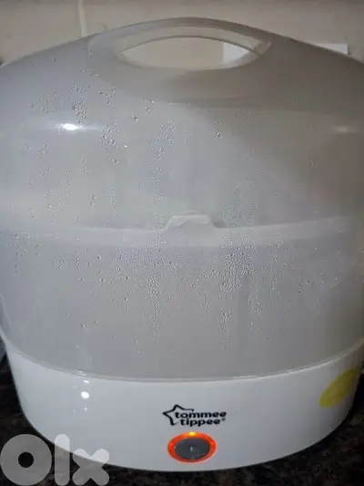 Tommee Tippee Sterilizer + free baby clothes