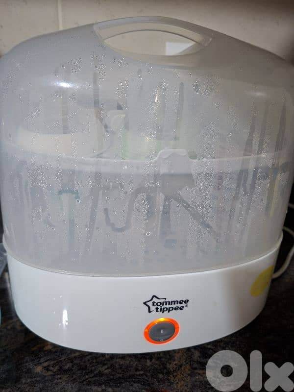Tommee Tippee Sterilizer + free baby clothes 1