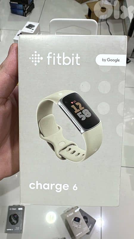 Fitbit Charge 6 silver case,porcelain band 0