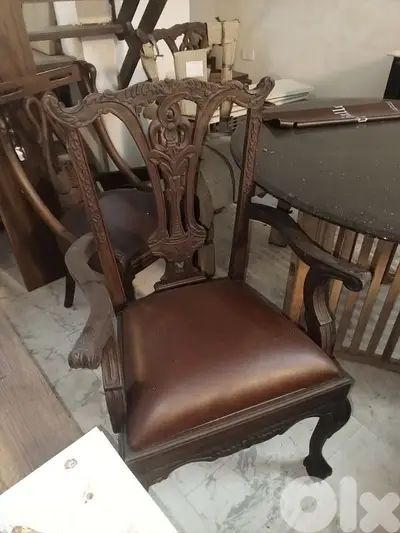 teak wood and leather armchairs