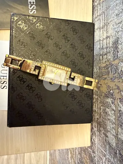 new guess gold watch with box and warranty card from abc department