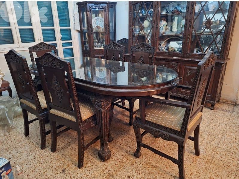 complete dining table and 8 chairs (2armchairs)  2 showcases 1