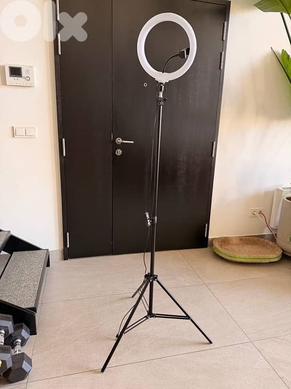 ring light with a tripod stand 0