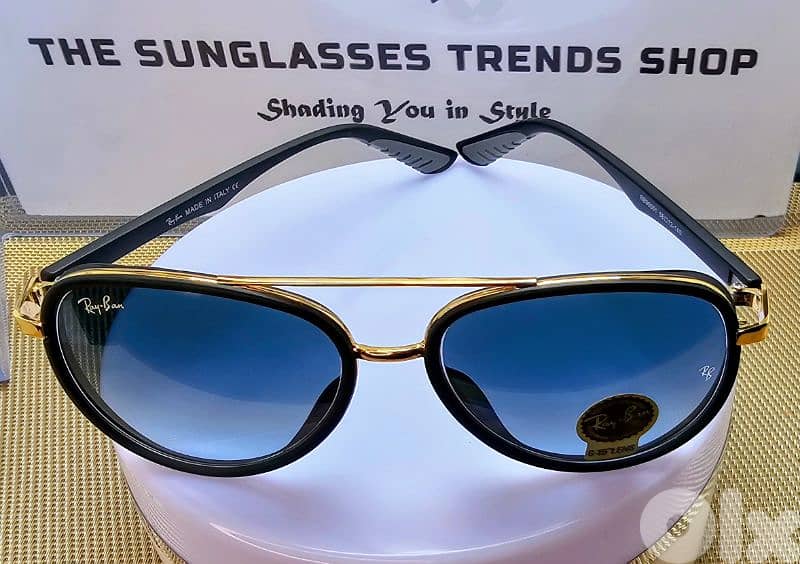 Ray-Ban sunglasses with gradient blue lenses. 0