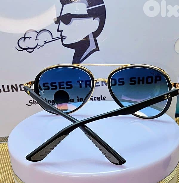 Ray-Ban sunglasses with gradient blue lenses. 3