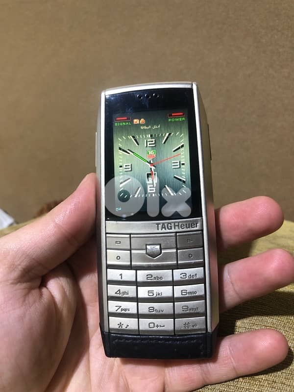 A genuine Swiss-made Tag Heuer phone that works well but need charger 0