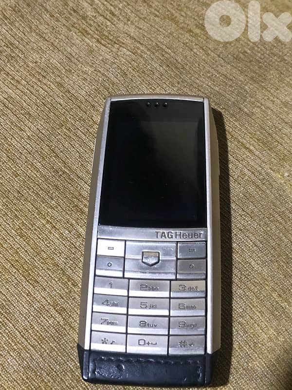 A genuine Swiss-made Tag Heuer phone that works well but need charger 6